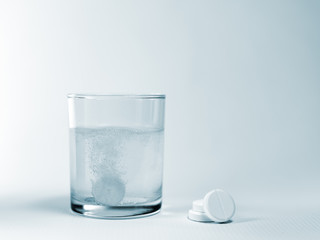 Closeup of a glass of water with effervescent tablets
