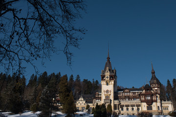 Obraz premium Dramatic photo of Peles Castle in winter season. Romania, Sinaia