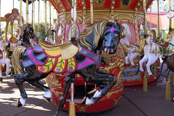 Carousel for children with horses attractions in the Park