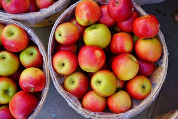 Baskets of fresh apples at a farmers market