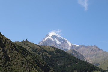 Fototapeta premium Stepantsminda church in Georgia mountains