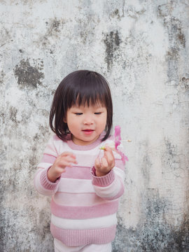 Asian little girl with Ceiba insignis flower