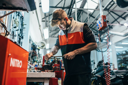 Mechanic working in the motorbike workshop