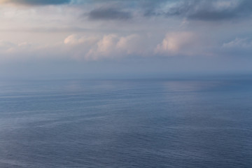 During the dawn, the mist manages to erase the boundary between the sky and the sea.