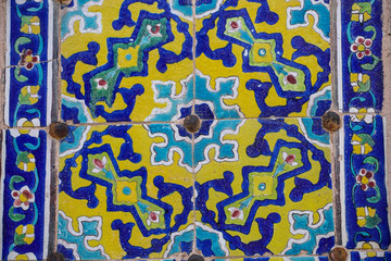 Colorful mosaic and ceramic tiles on the wall of the old Jameh Mosque in Qazvin, northern Iran