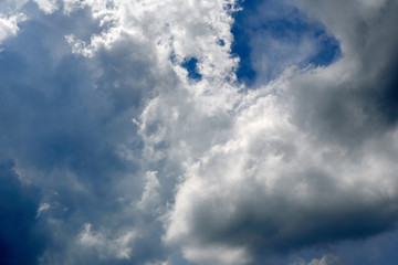 A light and dark sky on a rainy day.