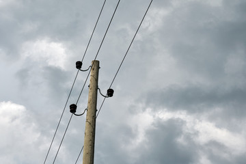 Power pole with a grey skyed background