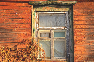 Old window in the house in brown tones