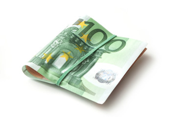 closeup of banknotes bundle of hundred euros money on white background