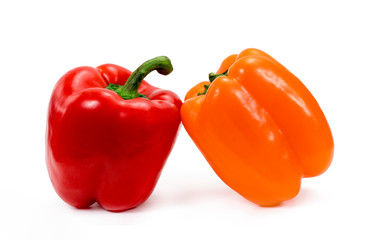 red and orange peppers on a white background