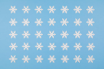 Paper snowflakes on a blue background