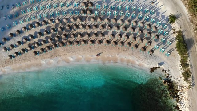 Sunrise at Porto Vathy Beach Thassos or Thasos Island Greece aerial video footage of tourists on the beach shot using a drone