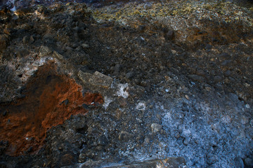 Aerial top view of sea waves hitting rocks on the beach with turquoise sea water. Amazing rock cliff seascape in the coastline. Aerial view of sea waves and fantastic Rocky coast. Mediterranean Sea.