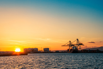 Fototapeta na wymiar Commercial harbor at sunset