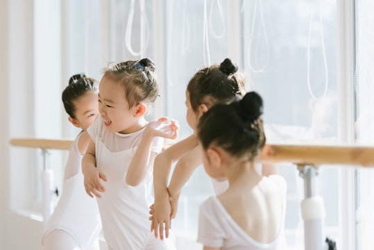Cute ballet girls having a rest in ballet studio