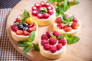 raspberry cake with cream cheese, mint on crumbly dough. Cake with raspberries