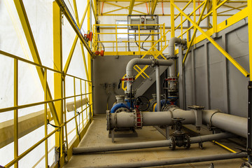 pumping unit and piping under cover