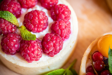 raspberry cake with cream cheese, mint on crumbly dough. Cake with raspberries