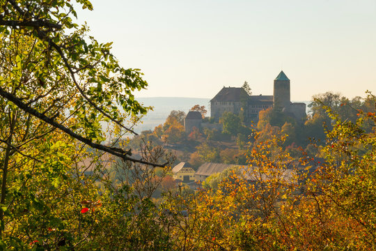 Autumn castle Colmberg on a hill surrounded by yellow leaves and trees, Middle Franconia, Bavaria, Germany. Burg Colmberg.