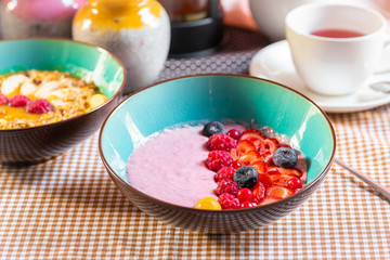 Porridge of muesli with fruit. Fresh fruit in porridge. Muesli with fruits. Muesli with fruit puree.