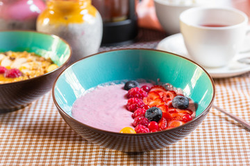 Porridge of muesli with fruit. Fresh fruit in porridge. Muesli with fruits. Muesli with fruit puree.