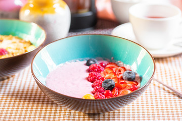 Porridge of muesli with fruit. Fresh fruit in porridge. Muesli with fruits. Muesli with fruit puree.