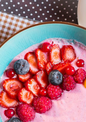 Porridge of muesli with fruit. Fresh fruit in porridge. Muesli with fruits. Muesli with fruit puree.