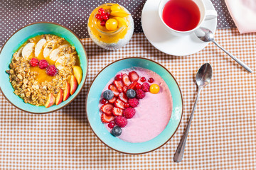 Porridge of muesli with fruit. Fresh fruit in porridge. Muesli with fruits. Muesli with fruit puree.
