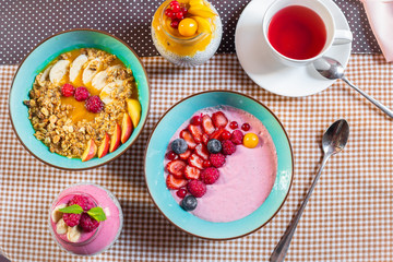 Porridge of muesli with fruit. Fresh fruit in porridge. Muesli with fruits. Muesli with fruit puree.