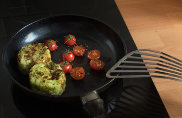 Breakfast cooking with tomato and Potato on pan