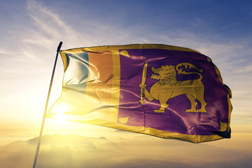 Sri Lanka lankan flag textile cloth fabric waving on the top sunrise mist fog