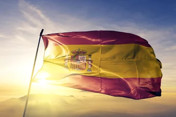 Foto op Canvas Spain spanish flag textile cloth fabric waving on the top sunrise mist fog © Oleksii