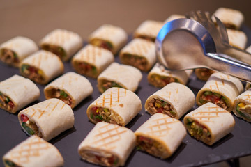 canape in pita bread stuffed with meat and vegetables - coffee break