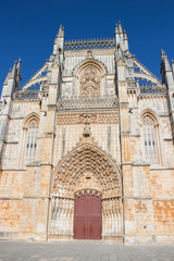 Batalha Monastery, also known as Monastery of Saint Mary of the Victory (Mosteiro da Batalha/Mosteiro de Santa Maria da Vitória), with blue sky, Portugal