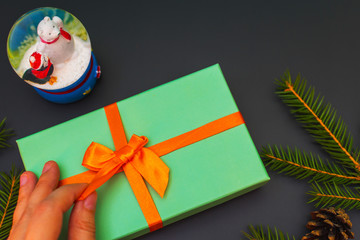 New year inspiration. Unties the ribbon on the gift box