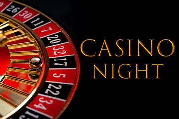 Casino night poster and gambling on games of chance concept with the ball in the winning number seventeen on a roulette wheel isolated on black background with gold text that reads Casino Night