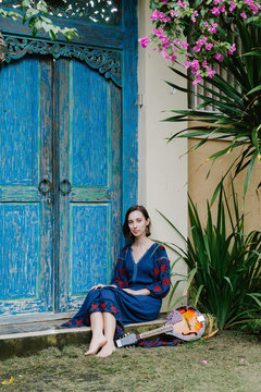 Girl sitting on porch