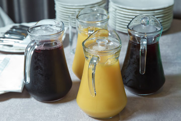 Yellow and red Glass Pitcher . yellow and red smoothie juice . Delicious orange juice in jug . uice in heavy glass jug Orange
