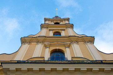 Peter and Paul Fortress close-up against a blue sky with clouds, vertical