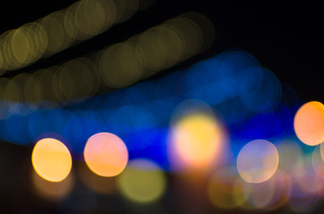 City, street, night defocused, light & blur bokeh. Colorful & dark background.