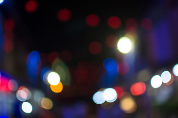 City, street, night defocused, light & blur bokeh. Colorful & dark background.