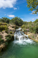 Fototapeta na wymiar Waterfall in the Ruidera lagoon, Castilla la Mancha