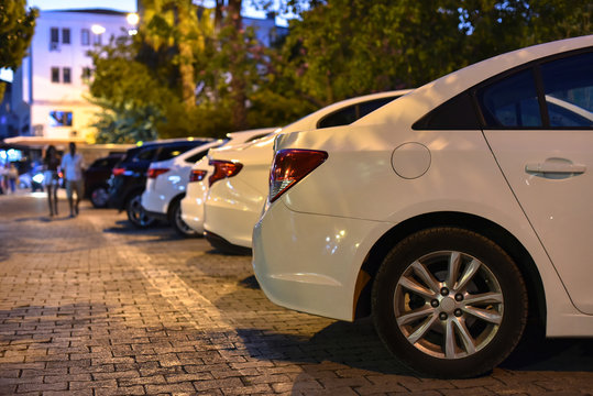 Row Of Parked Cars On Night Street