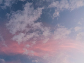 Pink sunset cloud with low wisps