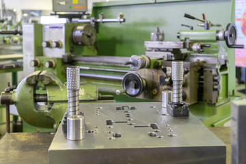 Machine workshop with lathe machine and bench vise