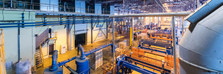 Fiberglass production industry equipment at manufacture background