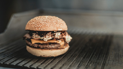 Close up. Worker Cooking Burger in Food Truck.