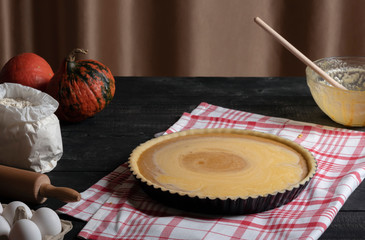 Pumpkin pie filling freshly poured in a tray