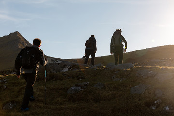 Group of friends exploring the never ending highlands in the Faroe Islands