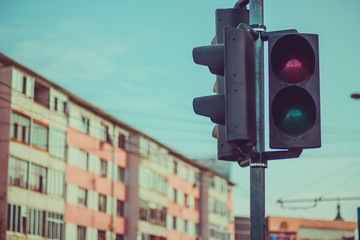 Traffic light with sign for pedestrians at crosswalk intersections